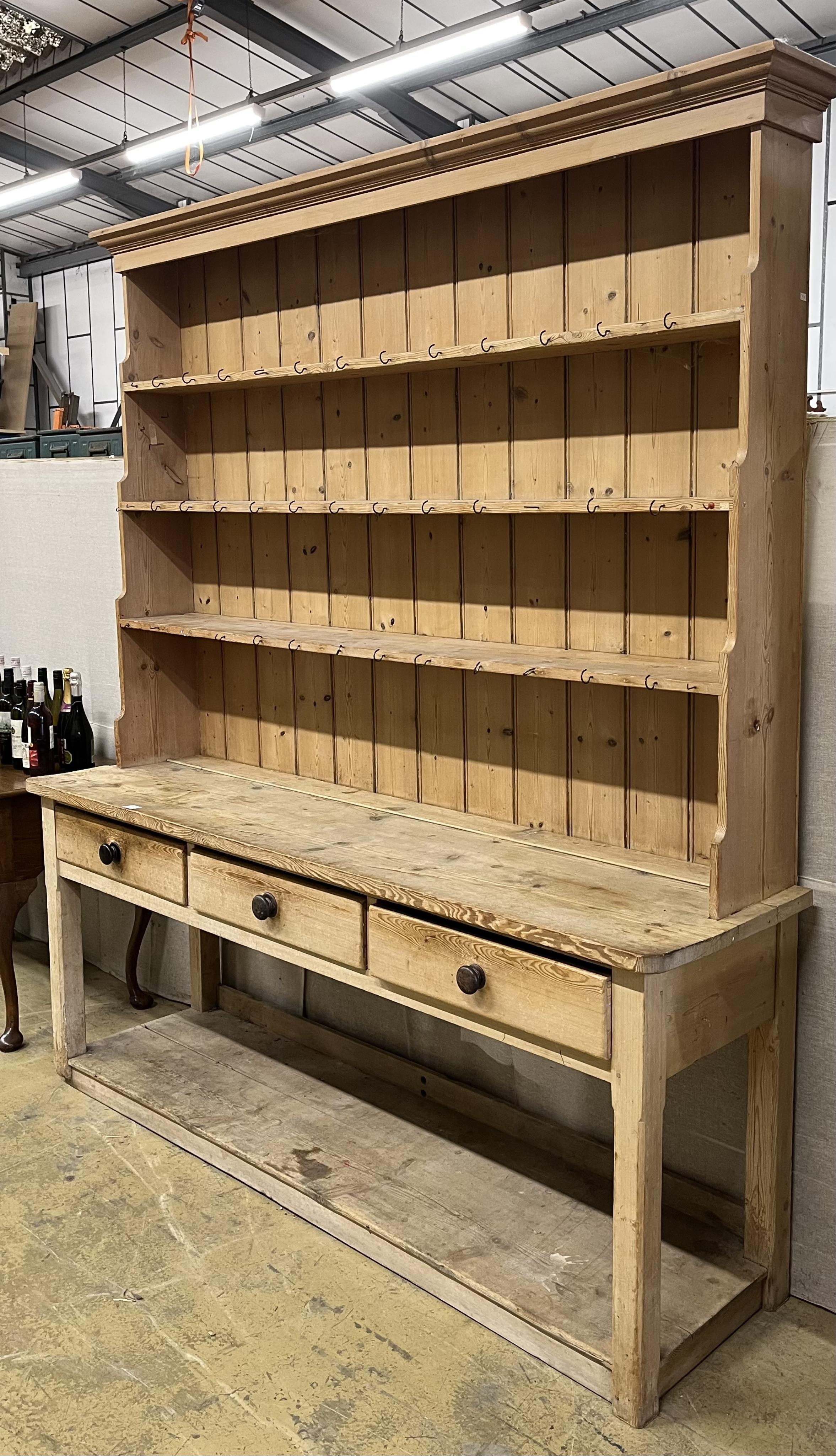 A Victorian pine potboard dresser with boarded rack, width 214cm, depth 55cm, height 88cm. Condition - fair